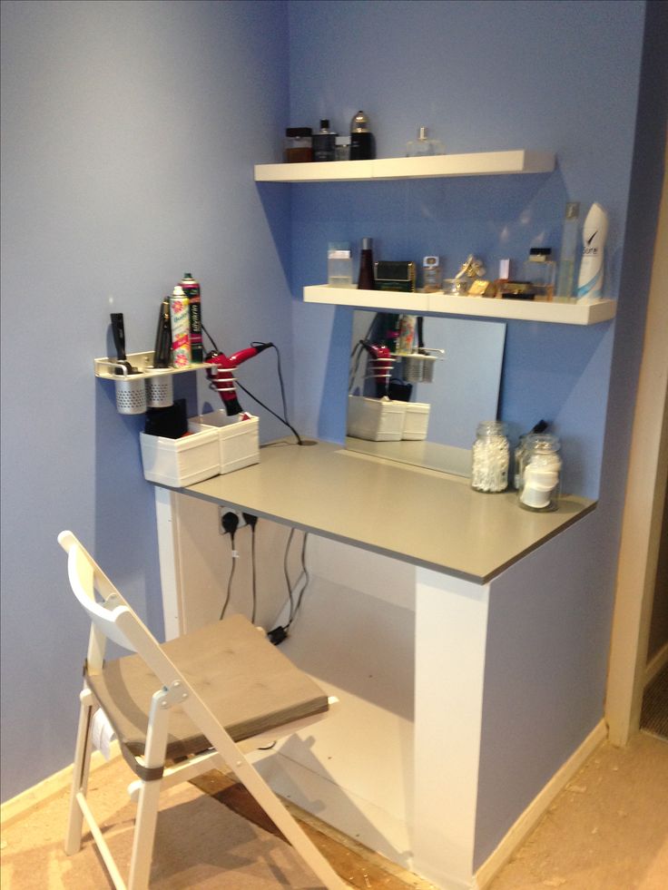 a white chair sitting in front of a desk