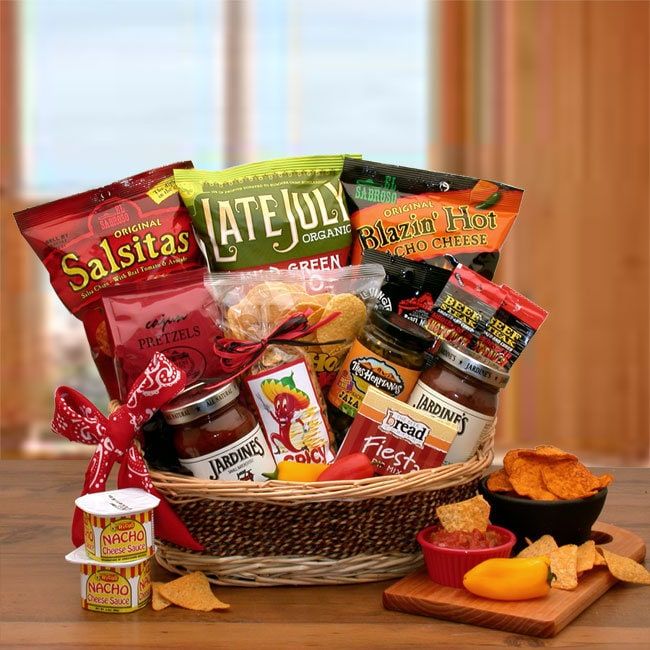 Some things don't come in small packages. Surprise them in a big way with our gourmet sampling of chips and salsa. We've included four different flavors of tortilla chips, gourmet Fiesta spicy cheese dip, nacho cheese sauce, salsas, and more. A true salsa lover's dream gift.  The A Little Spice Gourmet Salsa & Chips Gift Basket includes: Salsitas salsa tortilla chips, guacamole tortilla chips, blazin' hot nacho tortilla chips, white corn tortilla chips, Cajun pretzel waffles, flaming hot beef steaks stripes, spicy sliced jalapenos, nacho cheese dip, Fiesta spicy jalapeno cheese dip, spicy taco seasoned gourmet snack mix, black bean and corn mild salsa, and chunky mild salsa. Spicy Cheese Dip, Spicy Taco Seasoning, Basket Raffle, Nachos Cheese Dip, Snack Gift Baskets, Spicy Tacos, Spicy Cheese, Nacho Cheese Sauce, Mild Salsa