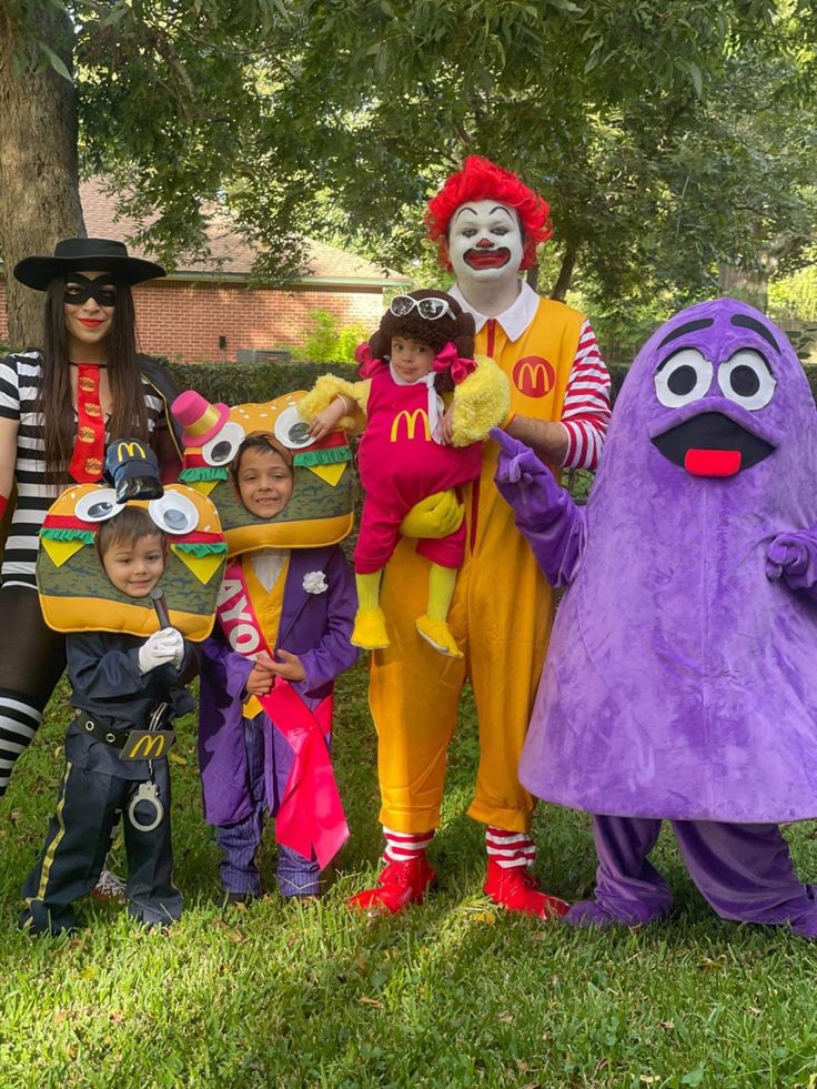 a group of people in costumes standing next to each other