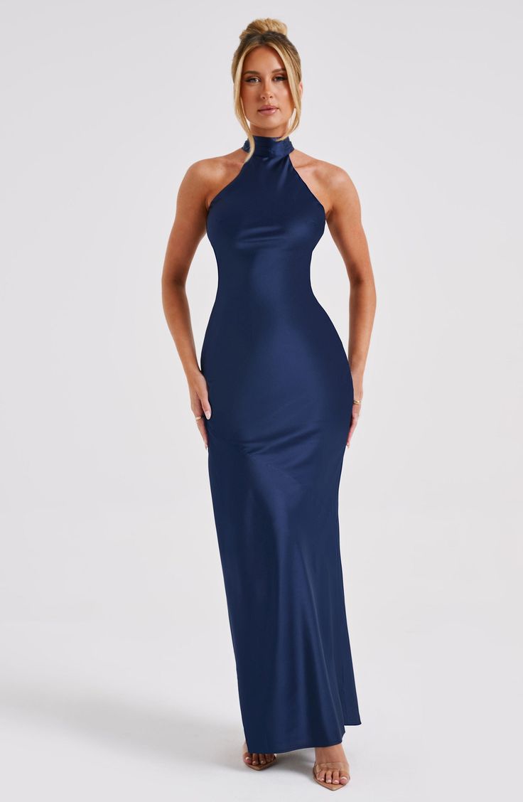 Here's to the nights you will remember because of the fits you won't forget. You will be unforgettable in Etta, our luxe maxi made from bias cut satin that skims beautifully over the body. The dress is completely backless with a high neck and an oversized tie neck detail. Elevate any look with Etta, platform heels and a sleek knot.


Colour: Navy.

Luxury bias cut satin.

High neckline.

Backless detail.

Skims over the figure.

Flares gently at the hem.

Maxi length.

Model is an XS and is wear Fitted Blue Maxi Dress With Bias Cut, Blue Silk V-neck Maxi Dress, Blue Satin Floor-length Maxi Dress, Blue Bias Cut Floor-length Maxi Dress, Elegant Navy V-neck Maxi Dress, Homecoming Dresses Corset, Midi Dress Wedding Guest, Maxi Dress Sale, Sparkle Dress