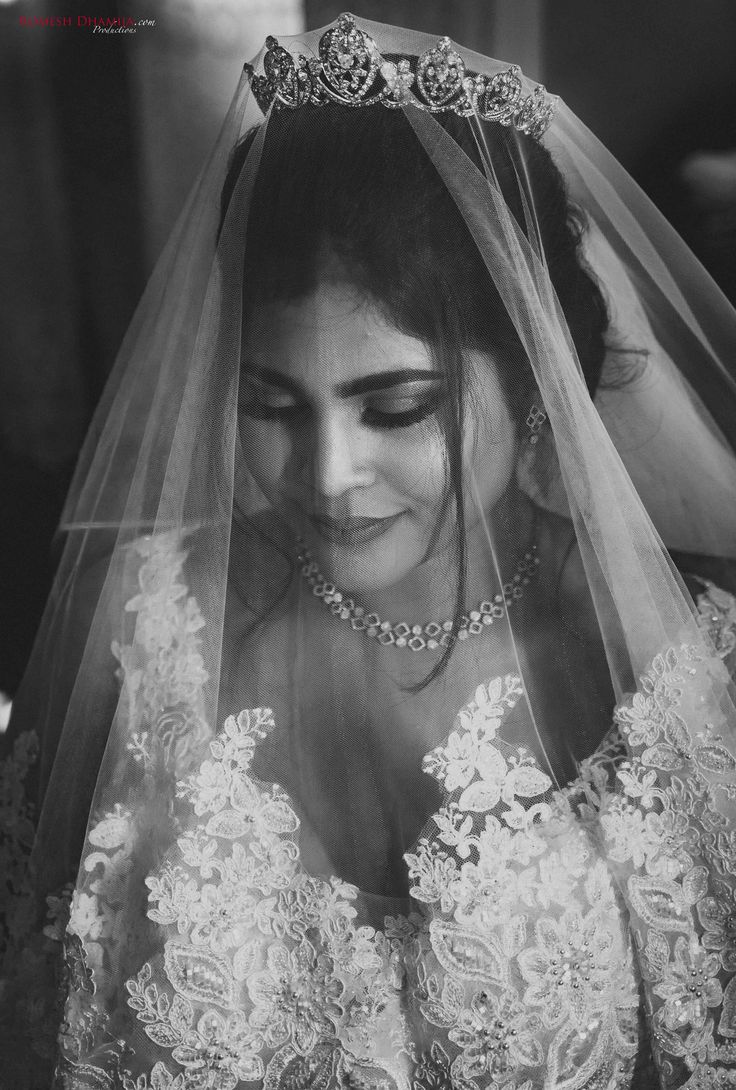 a woman in a wedding dress and veil