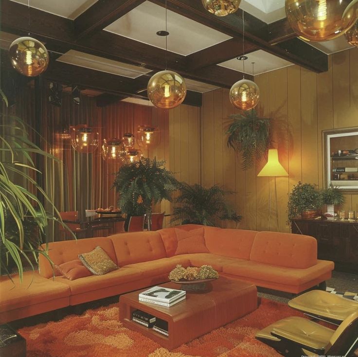 a living room filled with furniture and hanging lights