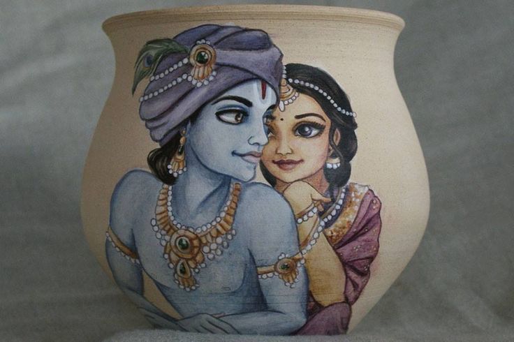 a ceramic pot with a painting of two women on it's face and one is holding the other hand