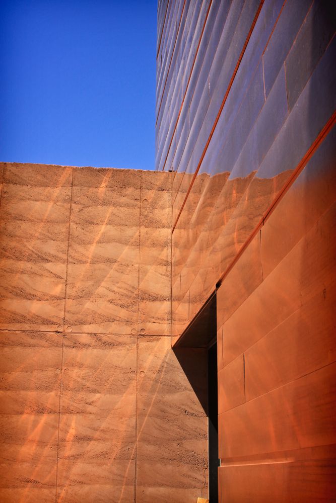 the side of a building with a clock on it