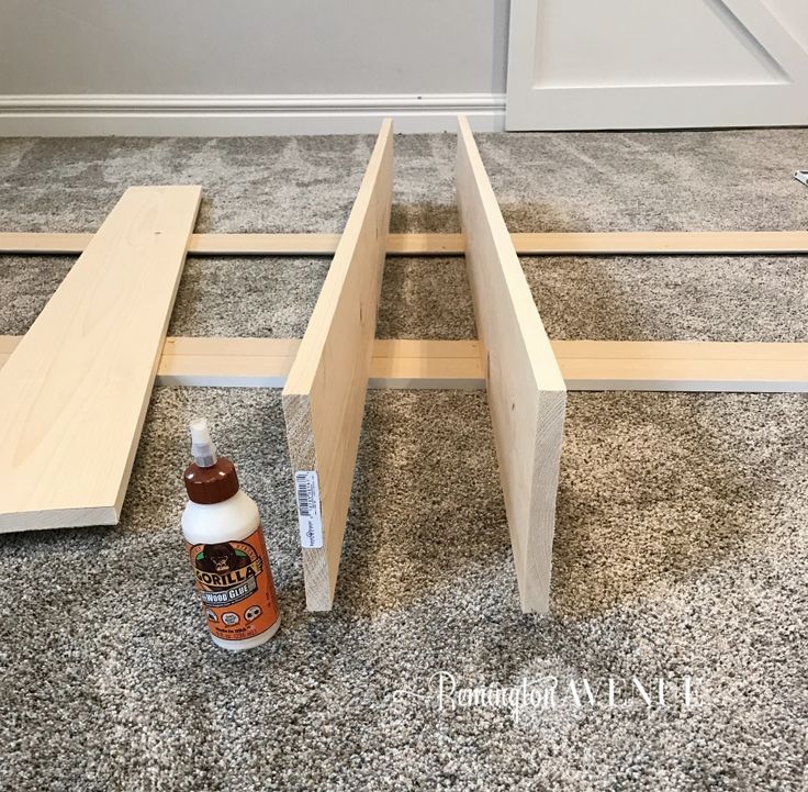 some wood is laying on the floor with glue