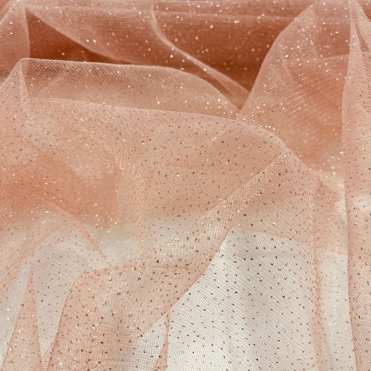 Introducing Glitter Mesh Fabric from Lace USA, an exquisite and high-quality fabric perfect for adding a touch of sparkle and elegance to your wardrobe. Perfect for wedding dresses, evening dresses, quinceanera dresses, and dance costumes, this fabric will make you feel like royalty. Made from 100% polyester and measuring approximately 60 inches wide, this beautiful fabric is available in 25 unique colors, each of which provides a unique blend of glitter and shimmer. Although some of the glitter Closed For Holidays, Red Hunter, For Wedding Dresses, Holiday Hours, Glitter Roses, Dresses Quinceanera, Lace Evening Dresses, Bridal Tiara, Dresses Evening