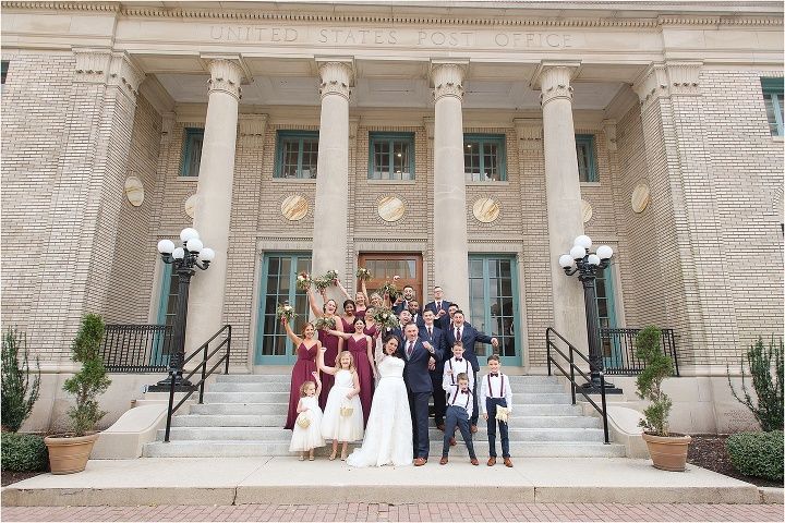 a group of people standing in front of a building