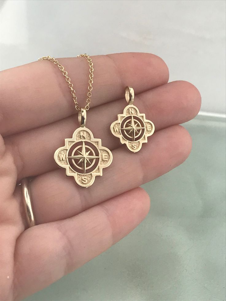 "✪ Please check the dimensions to be sure about the size! ♥ Solid Gold pendant 14k ♥ Dimensions: Small size: 2.1 x 1.5cm (include the loop) 1.5 x 1.5cm (without the loop) Large size: 2.4 x 1.8cm (include the loop) 1.8 x 1.8cm (without the loop) ♥ Dimensions of the loop: about 4x3mm (the inner) ♥ If you have thicker chain, write me a note and i will make larger loop for your chain. 🎁 All of our jewelry are beautifully boxed and ready for gifting For more pendants like this, take a look here: ♥ h Symbolic Compass Design Round Pendant Jewelry, Symbolic Compass Pendant Jewelry, Symbolic Compass Design Pendant Jewelry, Yellow Gold Pendant Jewelry For Travel, Amulet Style Pendant Jewelry With Compass Design, 14k Gold Medallion Jewelry With Compass Design, 14k Gold Compass Design Medallion Jewelry, Gold Medallion Jewelry With Compass Design, Travel Yellow Gold Jewelry With Compass Design