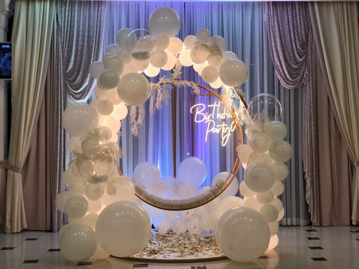 balloons and streamers decorate the entrance to a birthday party