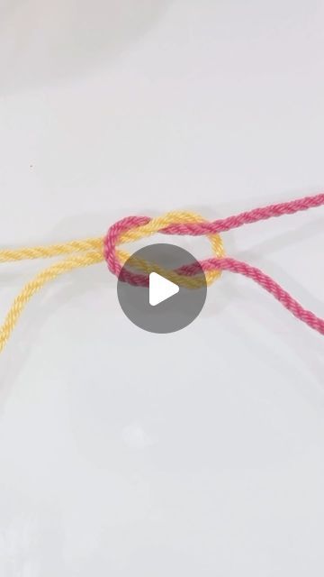 the video shows how to tie two different colored ropes with one end and another end