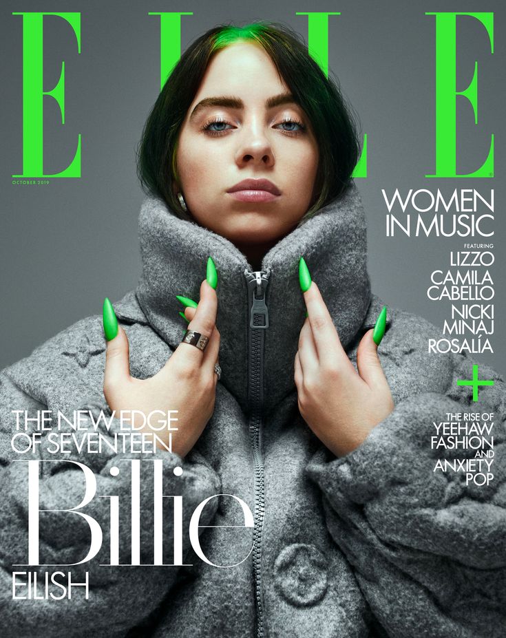 a woman with green nails on the cover of a magazine, wearing a grey coat