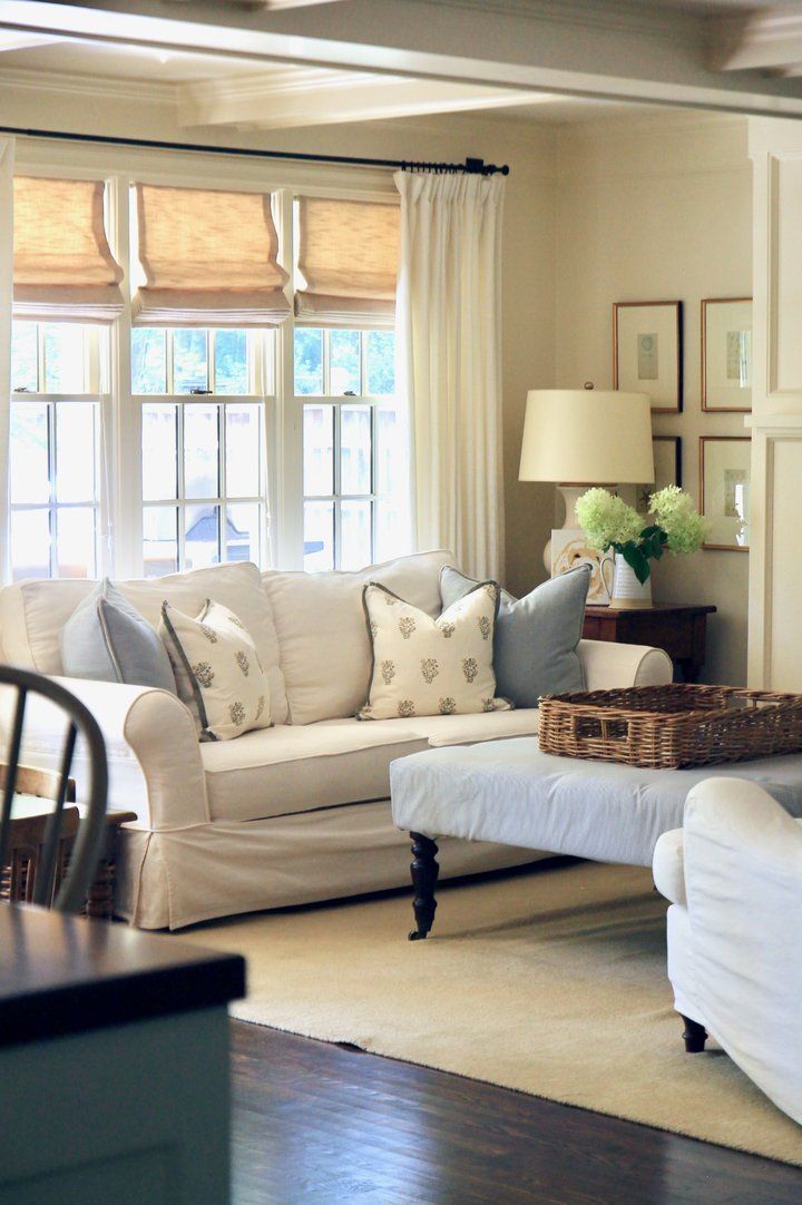 a living room filled with furniture and a fire place