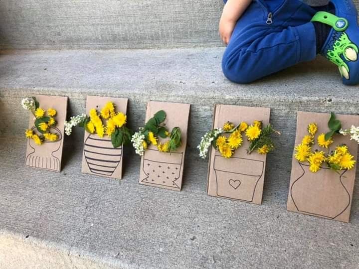 some little boxes with flowers in them sitting on the steps