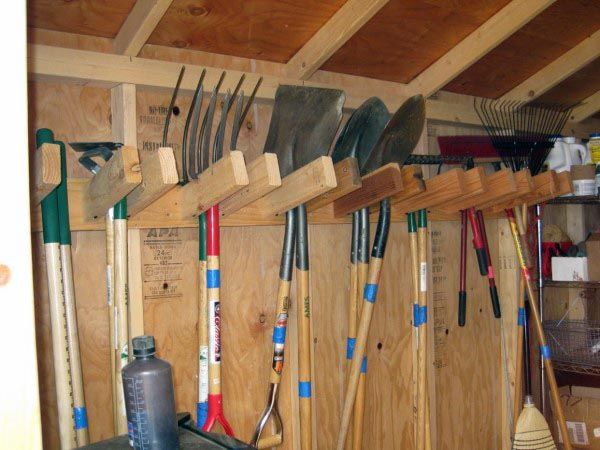 there are many tools hanging on the wall