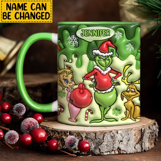 the grinch mug is next to some christmas decorations