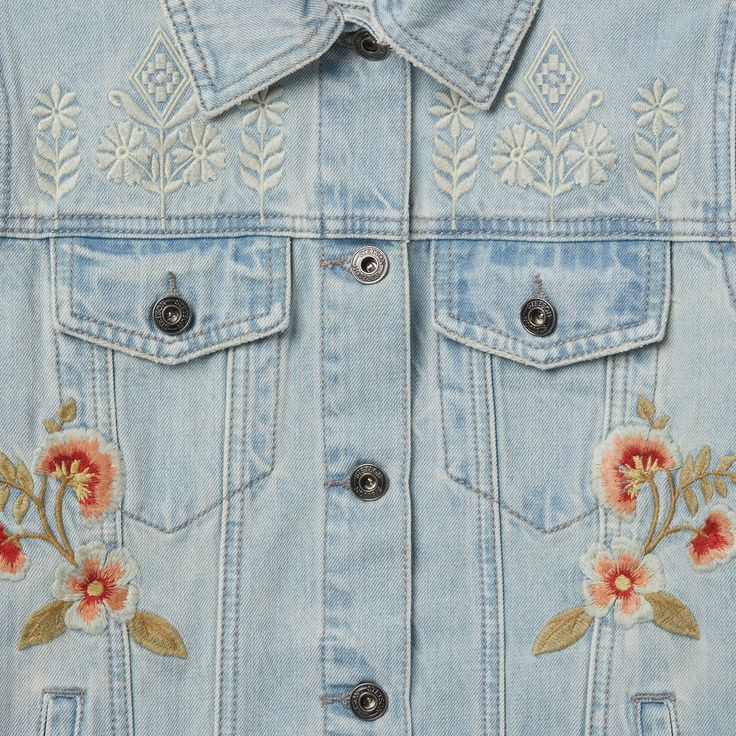 The denim jacket is a true essential, a storied piece of authentic Western outerwear. This version adds flower embroidery for a playful and feminine take on a classic. Finished with authentic details like back waist tabs, flap chest pockets, and metal buttons throughout. Sure to be a favorite throughout the season, and in seasons to come. 100% Cotton Welted Side Pockets Patch Back Yoke Straight Front Yoke Drop Shoulders Embroidered Imported Embroidered Denim Jacket, Casual Bottoms, Denim Boots, Wide Trousers, Denim Outerwear, Thigh Boot, Embroidered Denim, Women Shirts Blouse, Flower Embroidery