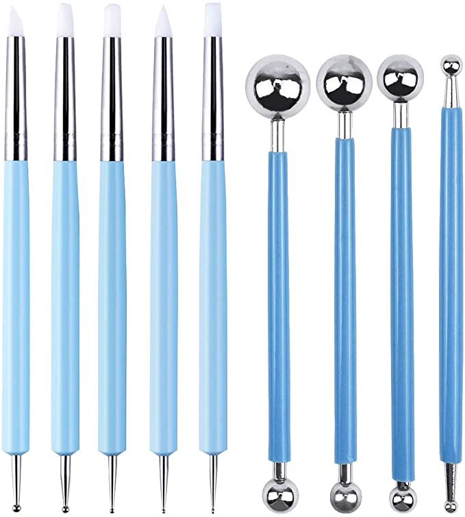 four different types of blue and silver ballpoint pens