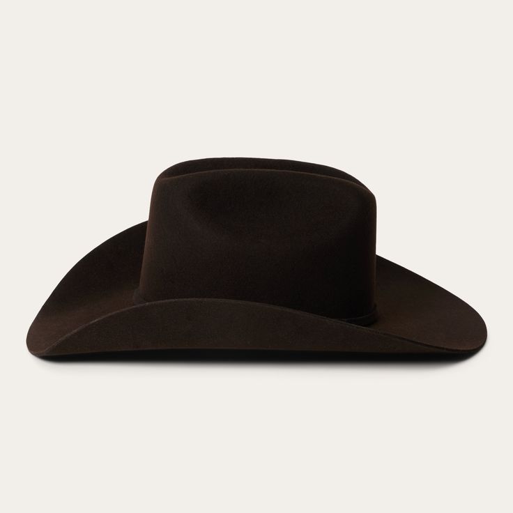 Part of our Buffalo collection, this cowboy hat is made in the USA of high-quality, weather-resistant 4X buffalo felt. Its classic Western profile features a classic cattleman crease, a 4" brim and a 4 5/8” regular oval crown. Additional details include a leather sweatband, satin lining, and a self-matching hat band with a three-piece silver-toned buckle set, as well as a Stetson hat box. 4" Brim 4 5/8" Regular Oval Crown Cattleman Crease Self-Matching Hat Band 3-Piece Silver Buckle Set Stetson Classic Top Hat For Western-themed Winter Events, Western Solid Hat Bands For Rodeo, Classic Brown Felt Hat For Rodeo, Classic Brown Fedora For Ranch, Solid Color Western Hat Bands For Western-themed Events, Solid Western Hat Bands For Western-themed Events, Classic Wide Brim Felt Hat For Rodeo, Western Style Solid Hat Bands For Western-themed Events, Western-style Solid Felt Hat For Western-themed Events