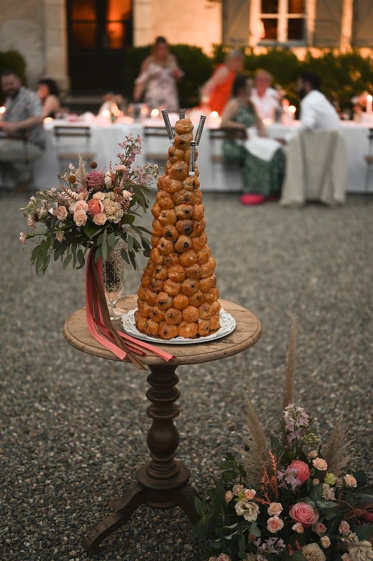 a table topped with lots of food and flowers