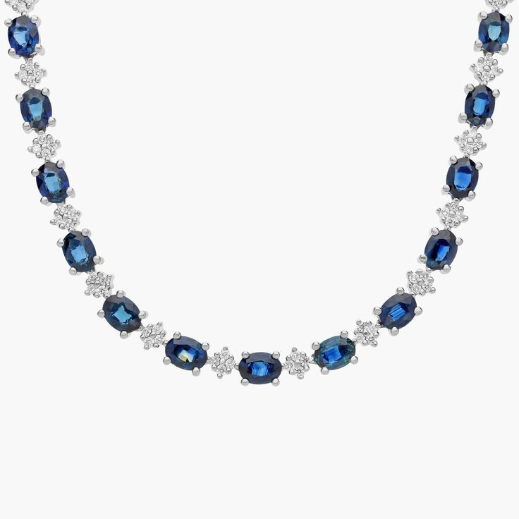 Vibrant sapphires and brilliant diamonds shine in this stunning necklace. Diamond Sapphire Necklace, Oval Sapphire Diamond Necklace, Luxury Sapphire Necklace For Formal Occasions, Formal Sapphire Necklace With Single Cut Diamonds, Formal Blue Necklaces With Single Cut Diamonds, Luxury Sapphire Round Necklace, Luxury Sapphire Round Necklaces, Formal Sapphire Necklace Fine Jewelry, Luxury Blue Diamond Cut Necklace