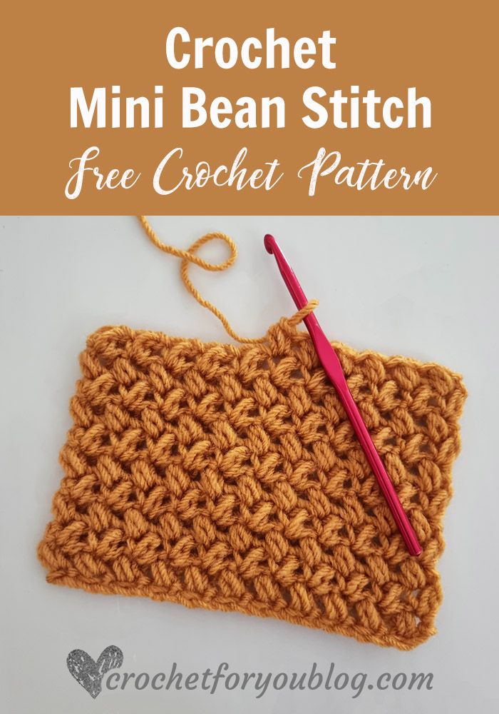 the crochet mini bean stitch is being worked on with a red knitting needle