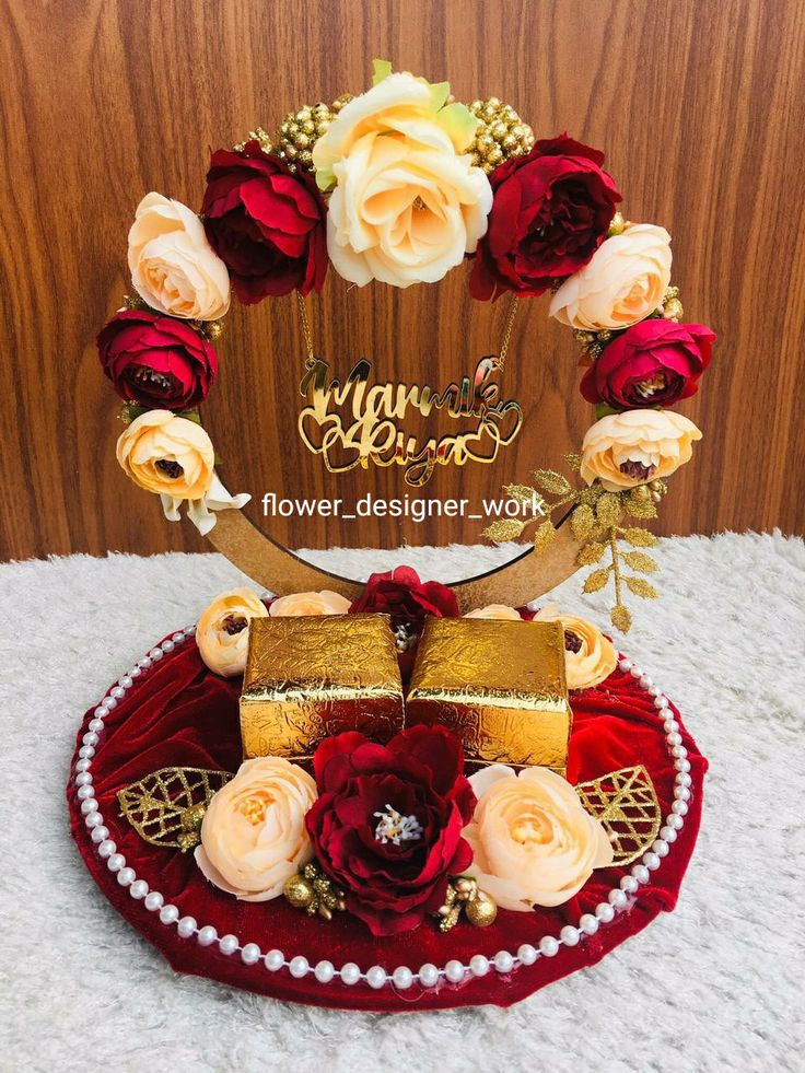 a red and gold cake with roses on it