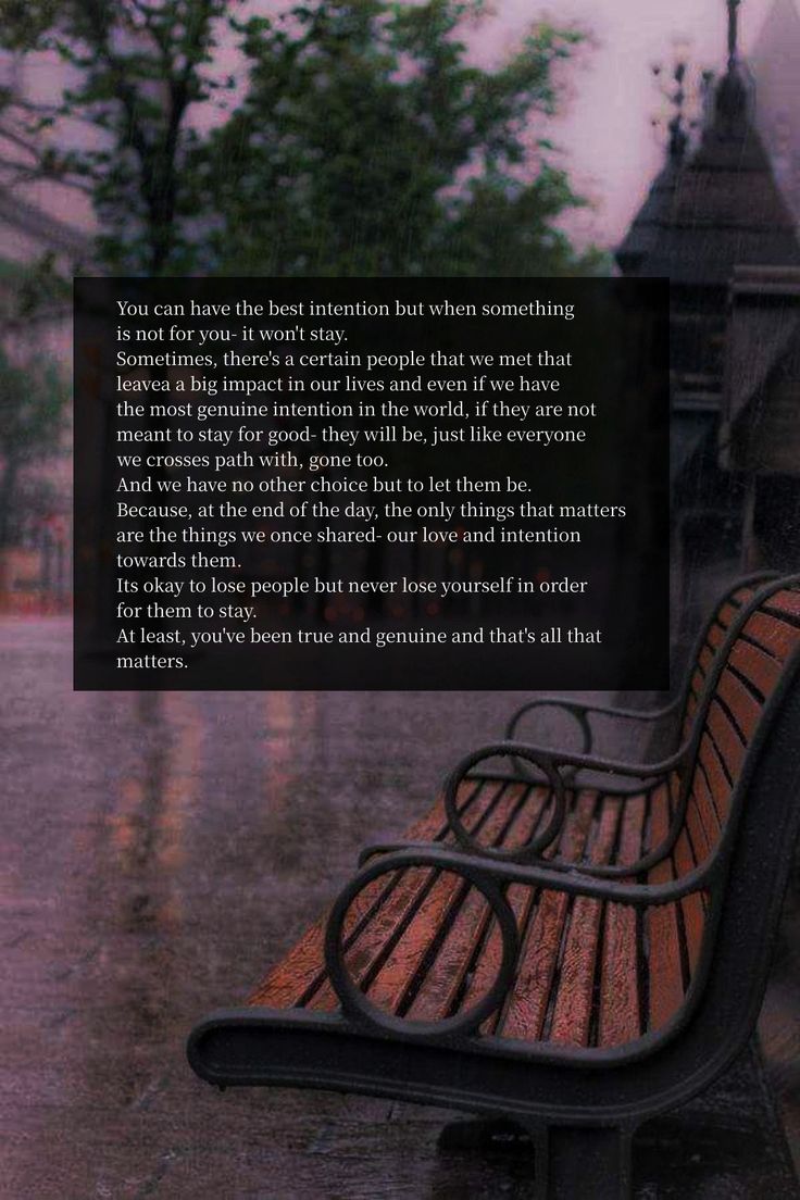 a bench sitting in the rain with a poem written on it's back side