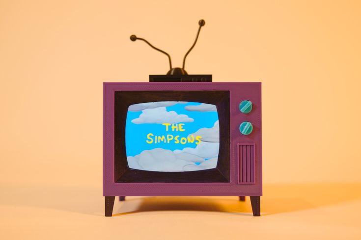 an old fashioned television with the simpsons on it's screen and its antenna pointing up