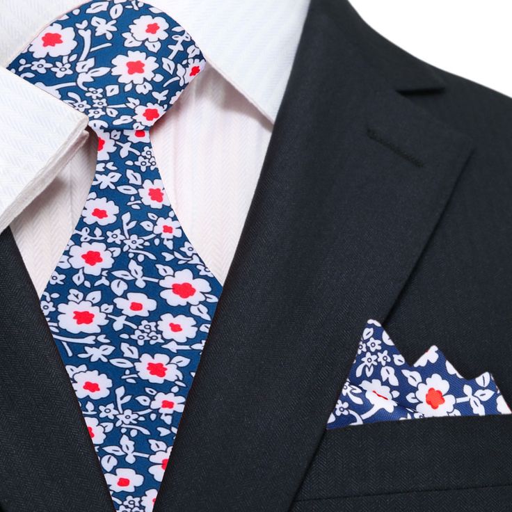 Red, Blue and White Small Flowers Tie Add a touch of elegance to any outfit with our blue and red floral tie. Made from high-quality silk, this tie features a striking floral pattern in shades of blue and red that is sure to turn heads. The bold colors and intricate design make it the perfect accessory for any formal occasion, from weddings to business meetings. The floral motifs are arranged seamlessly and gives a versatile look, can match with different types of suites and shirts. Upgrade your Classic Formal Ties With Floral Print, Dapper Red Tie For Semi-formal Occasions, Dapper Semi-formal Red Tie, Summer Formal Suit And Tie Accessories With Floral Print, Summer Formal Suit And Tie Accessories With Pocket Square, Elegant Multicolor Floral Print Suit And Tie Accessories, Summer Formal Ties With Floral Print, Elegant Floral Print Accessories For Black Tie, Red Tie With Pocket Square For Black Tie Event