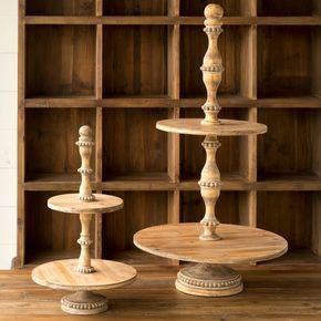 three tiered cake stand in front of a bookcase