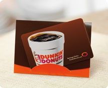 a dunkin donuts card sitting on top of a table next to a cup of coffee