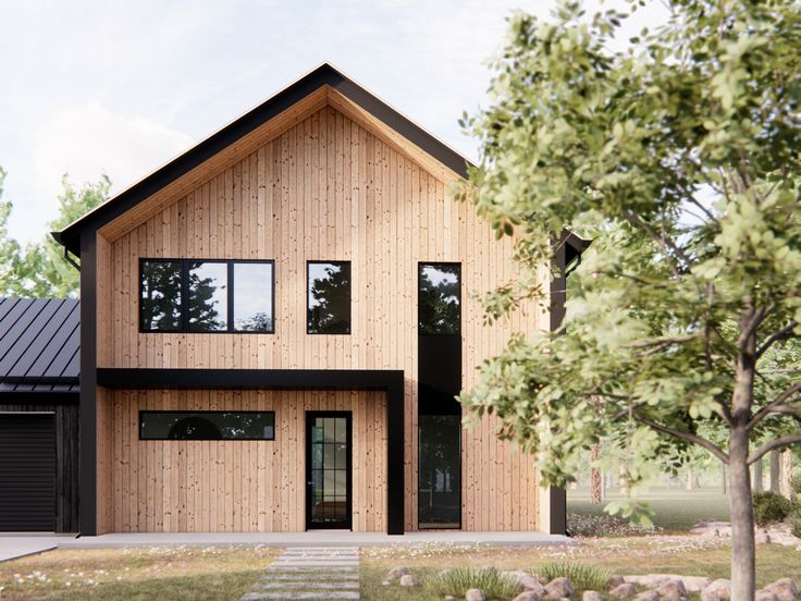 a two story house with wood siding and black windows