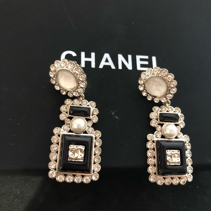 Chanel Earrings Brand New Come With Box Made In France Fast Shipping Pretty Good Condition Designer Black Clip-on Earrings, Designer Drop Earrings For Evening, Designer Drop Earrings For Formal Occasions, Designer Black Clip-on Jewelry, Chic Evening Jewelry With Black Enamel, Luxury Silver Clip-on Earrings For Evening, Black Enamel Clip-on Earrings For Evening, Luxury Drop Clip-on Earrings For Evening, Elegant Black Earrings For Formal Occasions