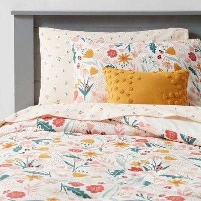 an image of a bed with flowers on it