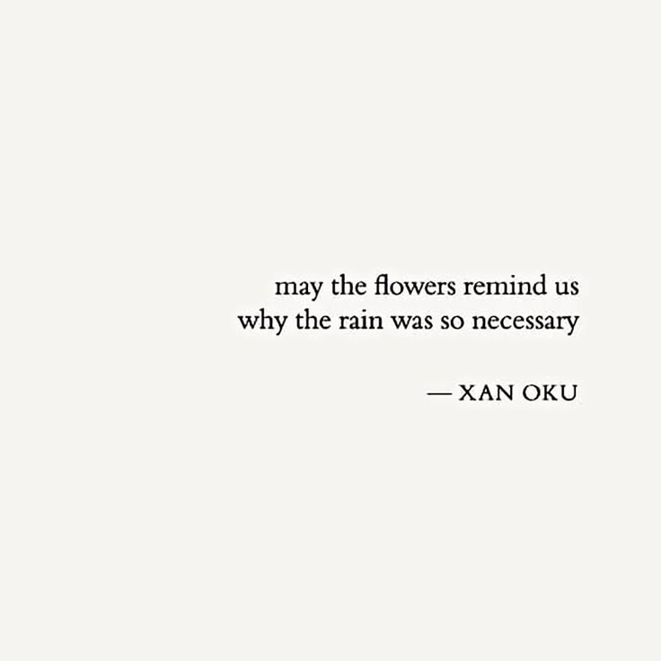 a white wall with a quote on it that says, may the flowers remind us why the rain was so necessary