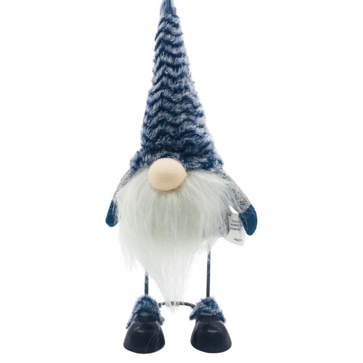 Blue Hat Standing Wire Leg Gnome HomeRoots offers a wide variety of choices in the tens of thousands and growing in furniture lighting and home decor products at extremely competitive pricing This Blue Hat Standing Wire Leg Gnome is different than the rest because of its standing metal body Most gnomes are all fabric but this one stands on metal frame legs and is perfect for your home Keep this guy out long past the holiday season He comes with a blue and grey striped hat as well This little guy is special because he adds character and animation to your home 11 x 3 62 x 5 5 Specifications . Color Blue. Material Fabric. Dimension 11 H x 3 62 W x 5 5 D. Weight 0 6 lbs Striped Hat, Christmas Tabletop, Whimsical Home, White Beard, Blue Wood, Blue And Grey, Blue Hat, Christmas Gnome, This Guy