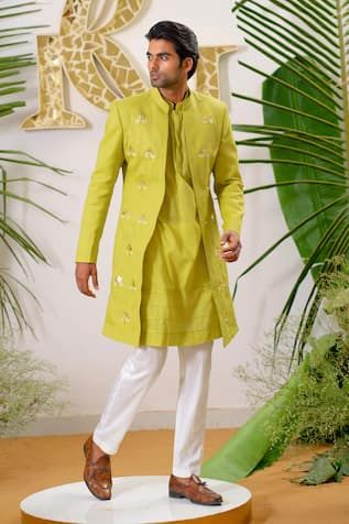 Fresh green full sleeve sherwani with gold filigree lotus applique embroidered motifs and embellished with cutpipe work. Paired with kurta and ivory pant pyjama.
Components: 3
Pattern: Embroidery, Embellished
Type Of Work: Cutpipe
Neckline: Mandarin collar
Sleeve Type: Full sleeves
Fabric: Sherwani: Cotton Linen, Kurta: Pure Cotton, Pant Pyjama: Vegan Silk
Color: Green
Other Details: 
Disclaimer: The fabrics used, are handwoven, hence may have impurities or slubs/variation in the weave that beau Lotus Applique, Green Sherwani, Linen Embroidery, Kurta Men, Embroidered Motifs, Nehru Jackets, Pattern Embroidery, Gold Filigree, Fresh Green