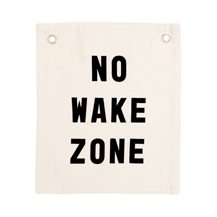 a sign that says no wake zone on it's back side, with the words in black and white