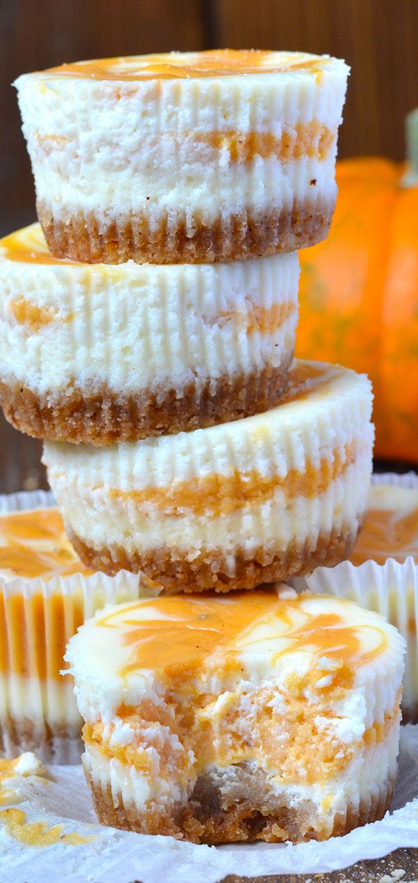 three desserts stacked on top of each other with frosting and pumpkins in the background