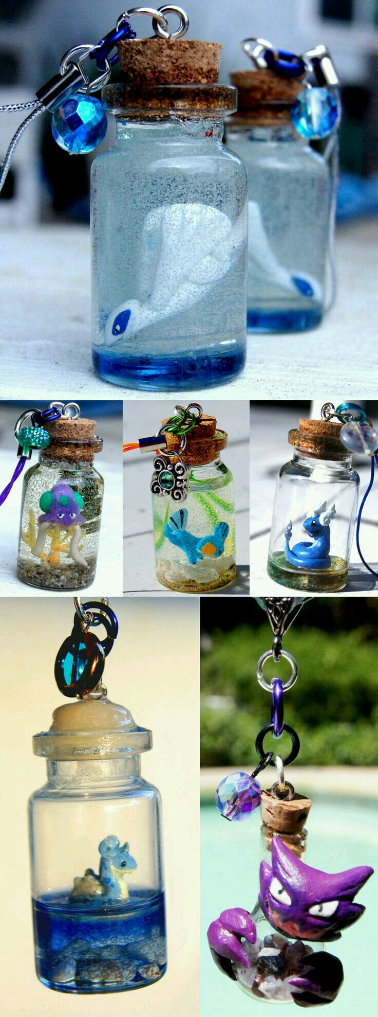 four different glass jars filled with sea animals and sand in them, hanging from strings