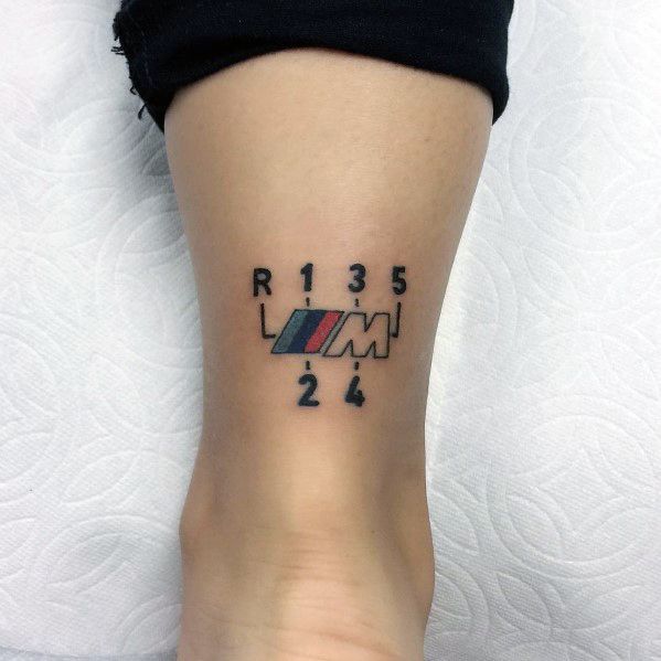 a woman's foot with a tattoo that reads r135 and 2 / 4