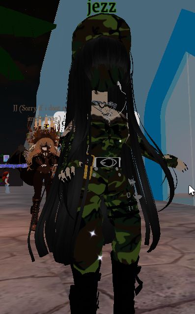 an animated image of a woman with long black hair and green camo outfit, standing in front of a building