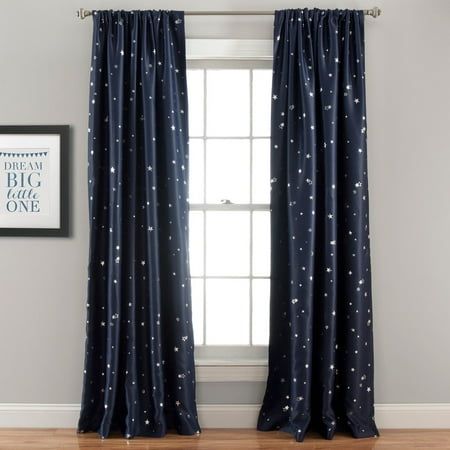 the curtains in this room are drawn with white stars on blue and black linens