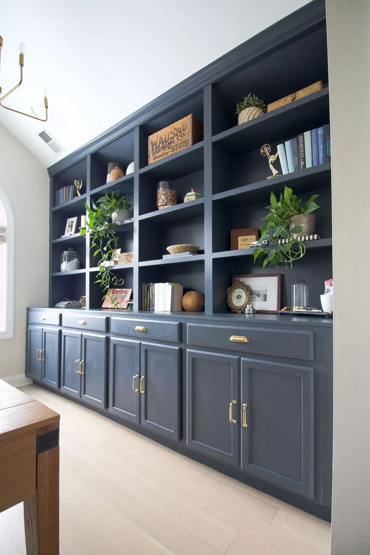 a large blue bookcase with lots of books on it