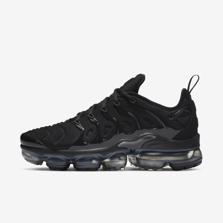 BLACKED-OUT AIR. The Nike Air VaporMax Plus looks to the past and propels you into the future. Made with at least 20% recycled material by weight, it keeps the future in mind while including design elements from the '98 Air Max Plus. Revolutionary VaporMax Air technology provides comfort and a modern look, while the floating cage, heel logo and iconic whale tail midfoot shank add heritage style. A sleek all-black upper and black rubber pods on the outsole show off your dark side. Benefits Origin Vapor Max Nike Women, Vapormax Women, Vapormax Plus Black, Nike Vapormax Plus, Vapormax Nike, Vapour Max Nike, Air Vapormax Plus, Nike Air Vapormax Plus, Nike Vapormax