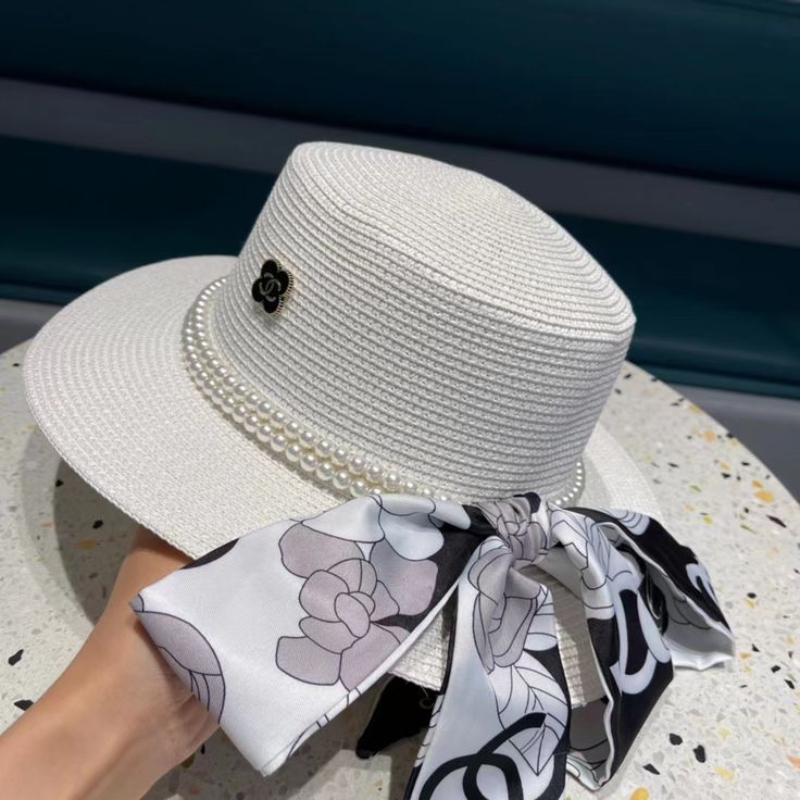 SHOP MORE LUXURY PRODUCTS HERE Description Chanel Boater Hat White This Hat chanel is designed for hot summer days. Exalting beauty and coolness WhiteWhite SedgeChanel Logo Includes box, dust bag.This product is of the premium quality. Luxury White Casual Boater Hat, Luxury White Straw Boater Hat, Luxury White Boater Hat, Luxury White Summer Hat, Luxury White Beach Hat, Hat Chanel, Dior Shirt, Gucci Shirt, Chanel Shirt