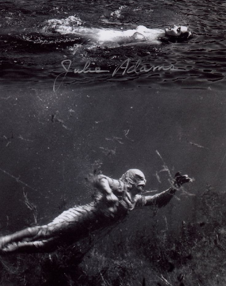 an old photo of a man swimming in the water