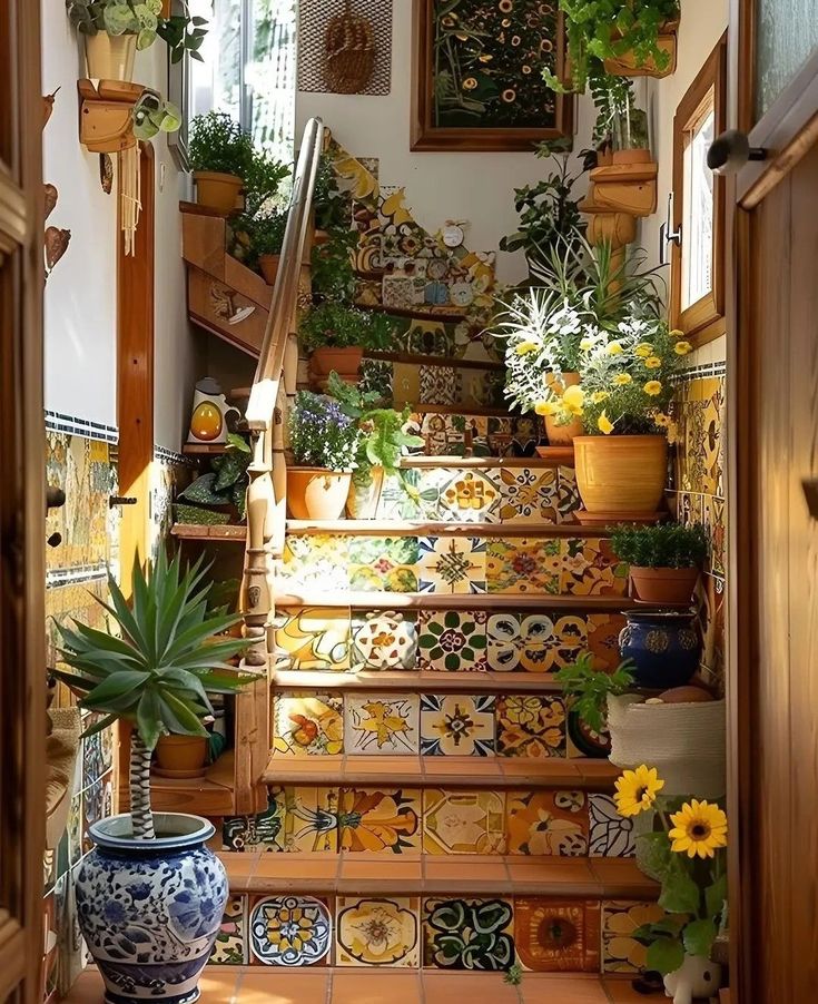 the stairs are decorated with colorful tiles and potted plants