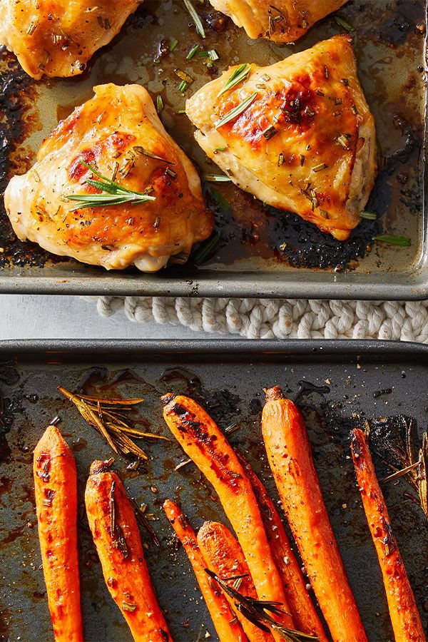 roasted carrots and chicken on a baking sheet