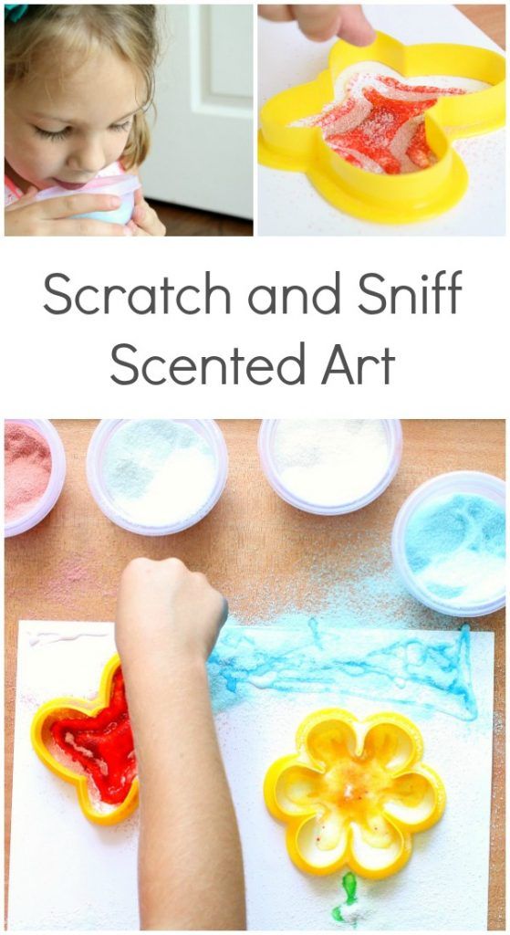 kids are painting with different colored paints on paper and then using scissors to decorate them